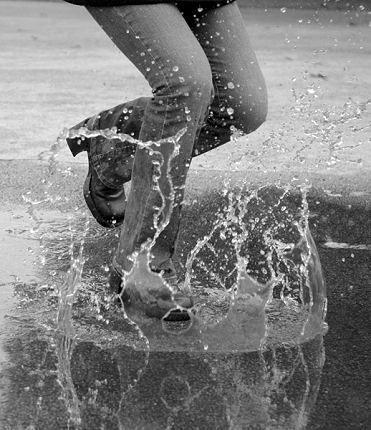Person Jumping In A Rain Puddle Pictures, Images and Photos