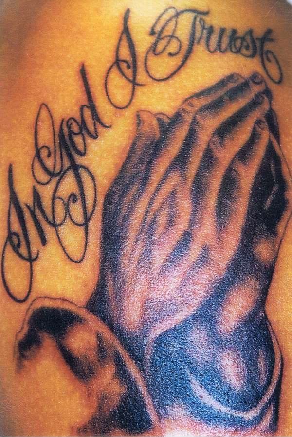 tattoos on fingers. praying hands tattoos.